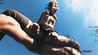 The guy has an incredible picnic with a sports model in the fresh air