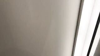 A hot chick is having fun with a guy in the fitting room of a store