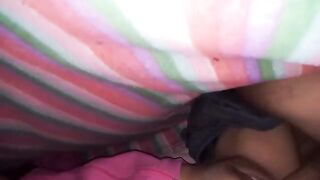 An amateur couple fucking under the sheets