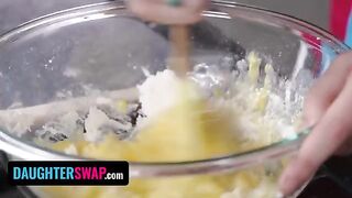 Two girls are busy in the kitchen, engaged in some intimate fun