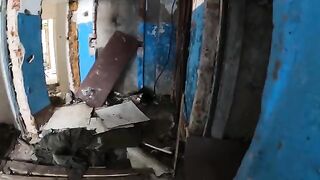 An exhibitionist girl walks through abandoned buildings, getting intimate in public