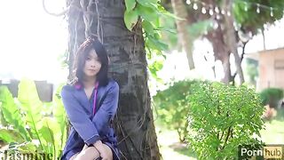A hot Asian girl masturbates with a vibrator and dildo in the garden