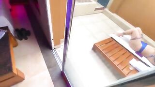 A redhead woman in bikini has sex with an employee right on the street