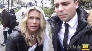 A blonde is having sex with a collector right in front of her future husband