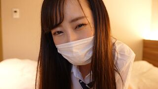 A Japanese girl in a sailor suit gives a guy a handjob