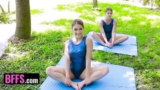 Gymnast girl Katie Kush is stretching with her coach Kenzie Madison