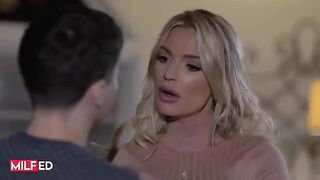 A stepmom is making her stepson a stunning blowjob in the living room