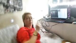 A mature woman is playing sexy games and fucking with her pussy