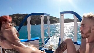 A gorgeous redhead has sex with her boyfriend on a boat in the ocean