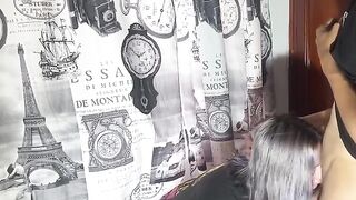 A very naughty girl talking on the phone with her boyfriend while being intimate with someone else