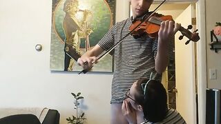 The couple was interrupted while the girl was trying to practice her violin