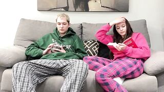 Pervert stepbrother jerks off next to his sister on the couch