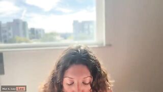 A cute woman has sex with her husband in front of people passing by