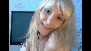 Blonde caresses her pussy with her fingers in a sensual act