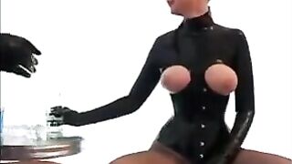 Two girls in latex tried to squeeze a cock through their stockings