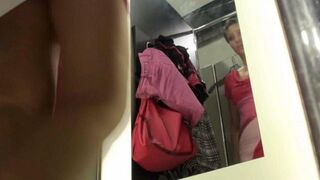 A peeping guy spied on a girl in the locker room of the store