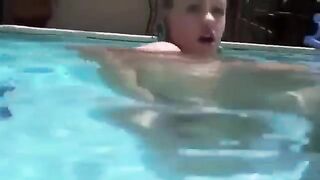 Babe in bikini inserts a dildo into her ass underwater