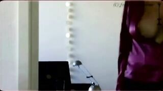 A peep show behind the big boobs of a camwhore