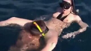 Underwater sex with aqualung-equipped lovers