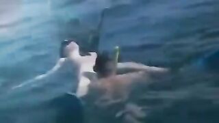 Underwater sex with aqualung-equipped lovers