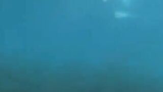 Underwater sex with aqualung-equipped lovers