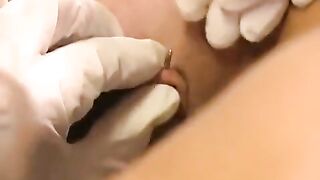 A girl with a clitoris piercing plays with her new sex toys