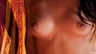 A chick with a nipple piercing plays with her tits and fingers her pussy