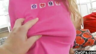 A sweet little girl caresses her body and plays with toys