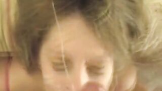 The cum on the face of a girl after blowing a dick