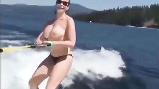 Topless beauty riding a water ski is incredibly erotic