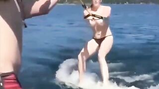 Topless beauty riding a water ski is incredibly erotic