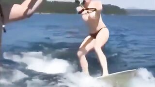 Topless beauty riding a water ski is incredibly erotic