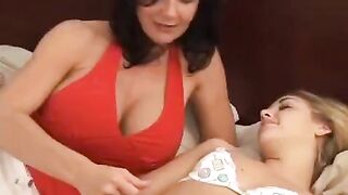Two girls having fun with each other using a strapon dildo