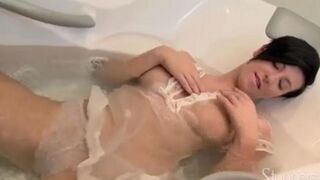 A lonely pregnant brunette masturbates on the couch, indulging in her desires