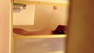 A girl has no shame and takes a shower, unaware of being watched