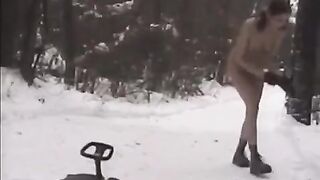Girls are having fun throwing snowballs at each other naked