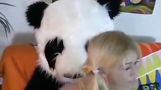 A sexy woman fucked by a bear in panda suit