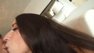 Two cute girls are fucking on the couch in a steamy scene