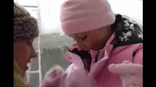 Lesbian beauties are having fun on a cold winter day