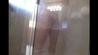 A man washing his body in the shower, cam filming