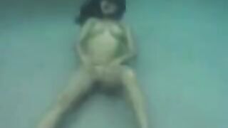 Sex in the ocean with busty brunette beauty