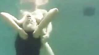 Sex in the ocean with busty brunette beauty