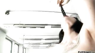 A brunette in high heels masturbates with a toy and finishes