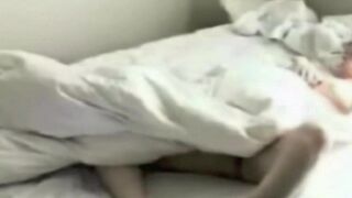 A girl masturbates in the bedroom, unaware of a hidden camera