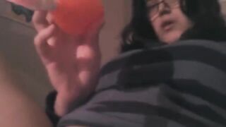 A girl plays with a vibrator and achieves intense clitoral stimulation