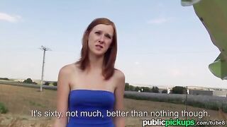 A red-haired girl is having fun with a guy in the hay pile
