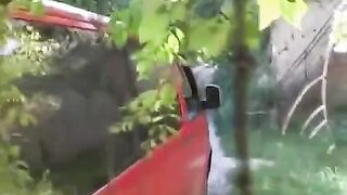 A man squeezed a girl against his car and she began to rub on his cock