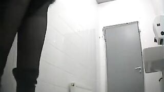 A hidden camera captured unexpected intimacy in a bathroom scene