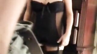 A husband shoots his sexy wife in corset trying on new stockings