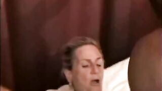 A mature woman is getting fucked by a black guy with big cock